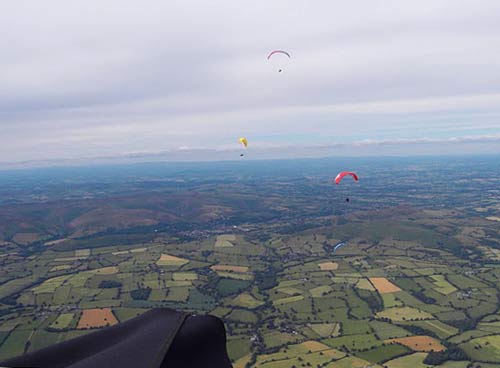 Long-Mynd-BCCup-2010 On glide, looking back at the Long Mynd during the British Paragliding Cup 2010. Photo: Ed Cleasby