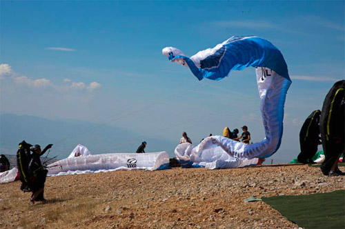 Racy... A comp glider on take off at the Paragliding World Cup Superfinal this week. Photo: Martin Scheel Racy... A comp glider on take off at the Paragliding World Cup Superfinal this week. Photo: Martin Scheel