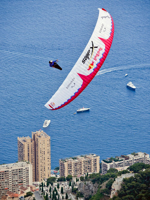 Not walking ... Chrigel Maurer stretches his wings after his 60km flight. Photo: Red Bull X-Alps