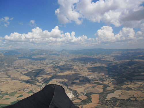 Judith Mole heads off on glide at the Ager Women's Paragliding Open 2011. Photos: Judith Mole