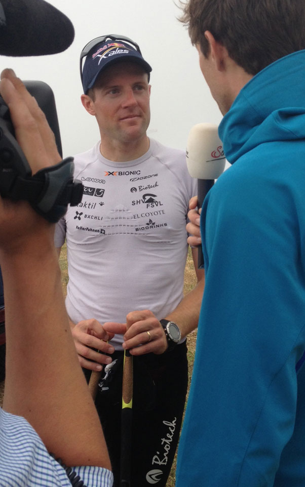 Chrigel on TV. He reached Peille at 11.10am local time, almost exactly a week after setting off from Monaco. Photo: Marcus King